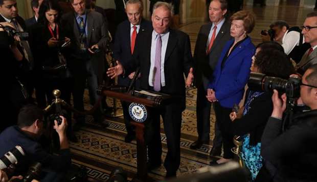 (L-R) Senate Minority Leader Charles Schumer (D-NY), Sen. Tim Kaine (D-VA), Sen. Tom Udall (D-NM) and Sen. Tammy Baldwin (D-MN) talk to reporters following the weekly Senate Democratic policy luncheon at the US Capitol January 14, 2020 in Washington, DC. Senate Majority Leader Mitch McConnell (R-KY) announced that US President Donald Trump's impeachment trial will begin in the Senate on Tuesday, January 21.