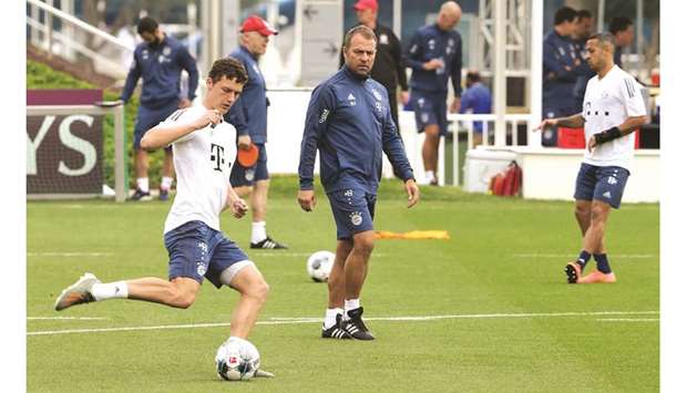 Bayern Munichu2019s head coach Hansi Flick (centre) leads a training session during the teamu2019s camp in Doha on January 9, 2020. (AFP)