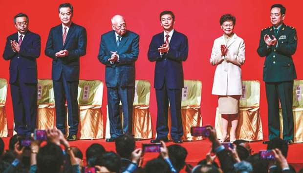 Chief Executive of Hong Kong, Carrie Lam (second right), stands on stage with other dignitaries at the Spring Festival Reception in Hong Kong yesterday.
