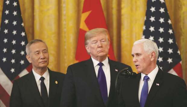 US Vice President Mike Pence (right) speaks as Liu He, Chinau2019s vice premier, listens during a signing ceremony for the US-China u201cPhase-1u201d trade agreement with President Donald Trump in Washington, DC, yesterday.