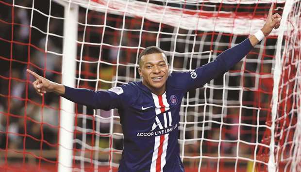 Paris St Germainu2019s Kylian Mbappe celebrates after scoring a goal against Monaco during their Ligue 1 match. (Reuters)
