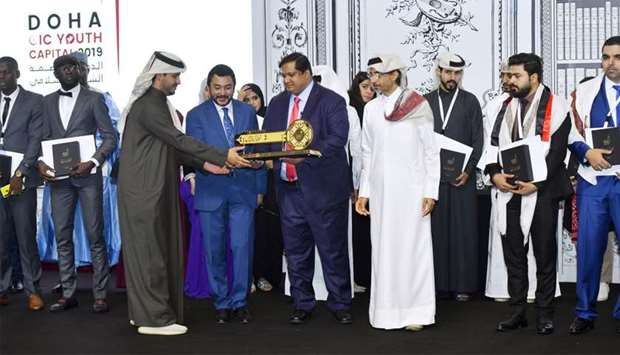 A symbolic key being handed over to Dhaka for the 2020 edition of the Capital of Islamic Youth initiative.