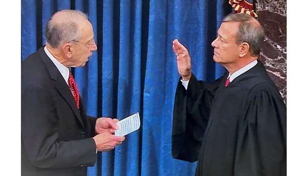 Senator Chuck Grassley, the president pro tempore of the US Senate, swears in US Supreme Court Chief Justice John Roberts to preside over the Senate impeachment trial of US President Donald Trump, in this frame grab from video.