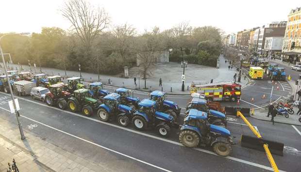 Farmers protest on St Stephens Green, near Government Buildings in Dublin on Wednesday.