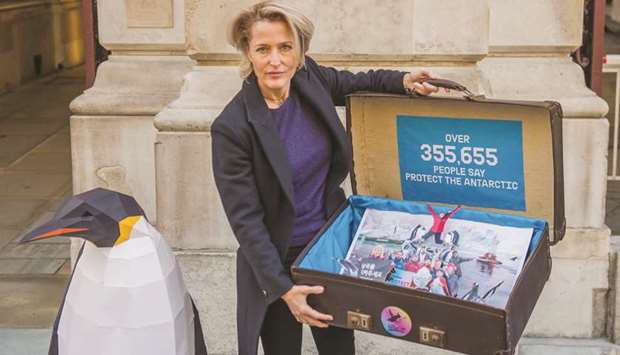 Actress Gillian Anderson delivering a Greenpeace petition to the Foreign Office in London in 2018.