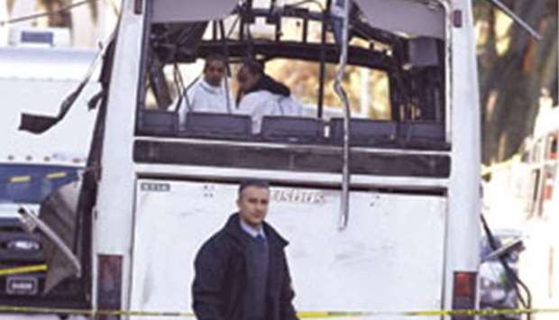 Forensics police inspect the presidential guard bus that was the target of Tuesdayu2019s suicide bomb attack in Tunis on November 24, 2015