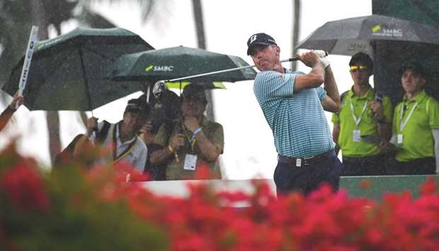 Matt Kuchar of the US hits a shot during round three of the Singapore Open golf tournament at the Sentosa Golf Club in Singapore yesterday.