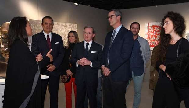 DIGNITARIES: From left, Mariame Farqane, CEO of Pallas Arts, explaining the artwork on display to Carlos Hernandez, Ambassador of Argentina to Qatar; Franck Gellet, Ambassador of France to Qatar; Alessandro Prunas, Ambassador of Italy to Qatar; and Noelia Paola Romero, wife of ambassador of Argentina, along with other visitors.