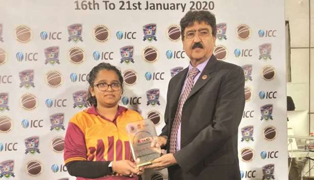 Qataru2019s Aleena Khan (left) receives player-of-the-match award.