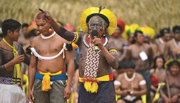 Indigenous leader Cacique Raoni Metuktire, of the Kayapo tribe, addresses members from different Brazilian tribes, in Piaracu village, near Sao Jose do Xingu, Mato Grosso state, Brazil, on Friday.