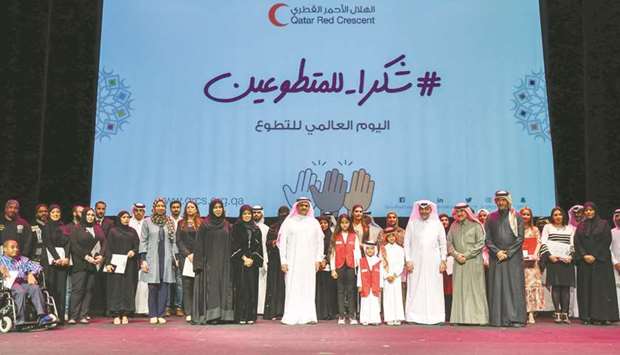 Dignitaries with the volunteers at the ceremony yesterday. PICTURES: Noushad Thekkayil