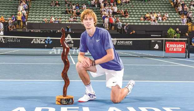 Andrey Rublev of Russia poses with the winneru2019s trophy after defeating Lloyd Harris of South Africa in their menu2019s final singles match at the Adelaide International tennis tournament in Adelaide yesterday.