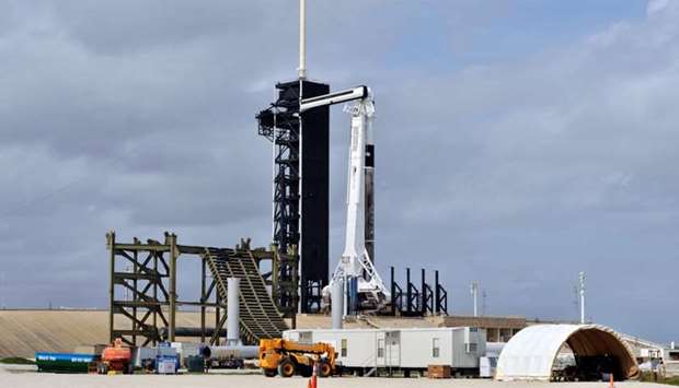 New construction surrounds the SpaceX Crew Dragon capsule atop a Falcon 9 booster rocket on historic Pad 39A at Kennedy Space Center at Cape Canaveral