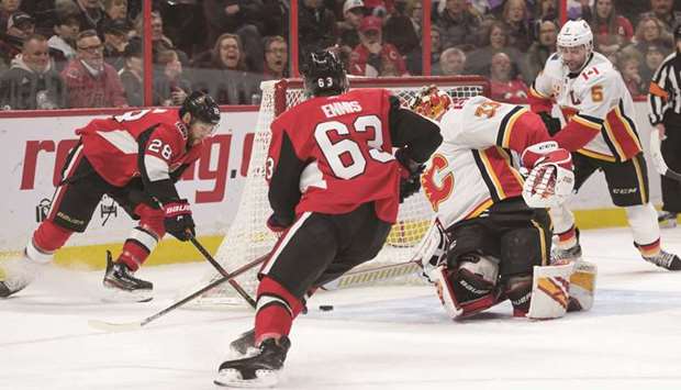 Ottawa Senators right wing Connor Brown (left) shoots the puck past Calgary Flames goalie David Rittich (second right) in the second period at the Canadian Tire Centre. PICTURE: USA TODAY Sports