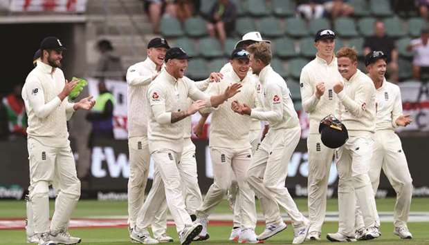 Englandu2019s Joe Root celebrates taking the wicket of South Africau2019s Pieter Malan (not in the picture) with teammates during the fourth day of the third Test at the St Georgeu2019s Park Cricket Ground in Port Elizabeth yesterday. (Reuters)