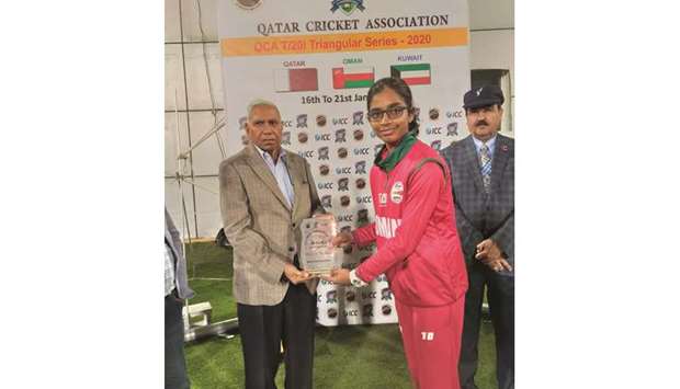 QCA Operations Manager Manzoor Ahmad (left) presents the Player of the Match award to Sakshi Vijaya .