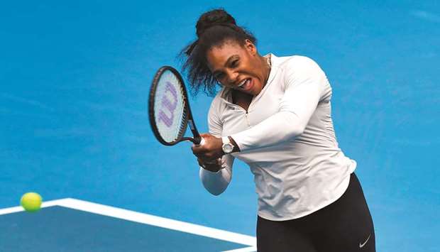Serena Williams of the US hits a return during a practice session ahead of the Australia Open tennis tournament in Melbourne.
