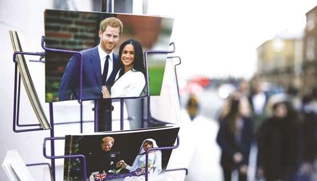 Merchandise depicting Prince Harry and Meghan are seen on display in a souvenir shop.