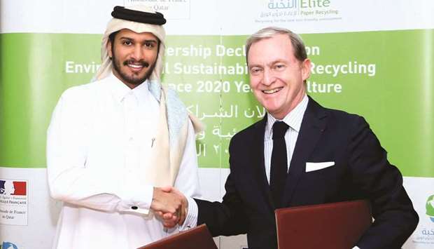 French ambassador Gellet and Elite Paper Recycling chairman al-Suwaidi after signing the partnership declaration in a ceremony held in Doha yesterday. PICTURE: Jayan Orma