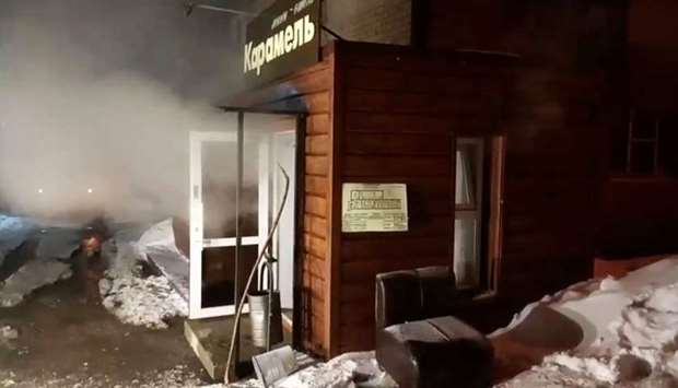 Steam comes out from a door of the Mini Hotel Caramel after a hot water pipe exploded in the night and flooded a basement hotel room with boiling water, in Perm, Russia. Russian Emergencies Ministry/Handout via REUTERS