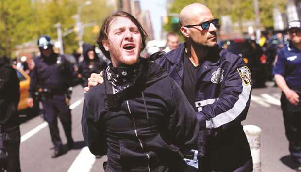 An NYPD officer arrests a demonstrator during May Day rallies in New York City in this 2013 photograph.