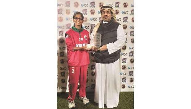 QCA PR Director Eissa al-Yacoub (right) presents the Player of the Match award to Omanu2019s Anshita Lalit on Sunday.