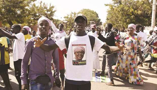 Supporters of newly-elected President Umaro Cissoko Embalo celebrate yesterday in Bissau after the announcement of the election results.