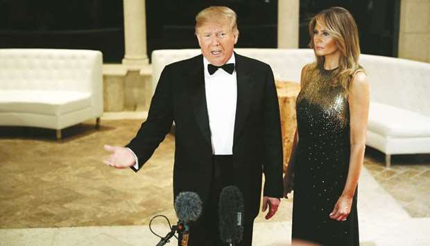 US President Donald Trump accompanied by first lady Melania Trump, speaks to the press at the Mar-a-Lago resort in Palm Beach, Florida, US.