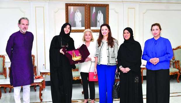 Qatar Chamber board member Ibtihaj al-Ahmadani handing over a token of recognition to Princess Beatrice of Orleans, in the presence of Spanish ambassador to Qatar, Belen Alfaro, and other dignitaries.