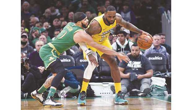 Boston Celtics forward Jayson Tatum (left) guards Los Angeles Lakers forward LeBron James during the second half at TD Garden. PICTURE: USA TODAY Sports
