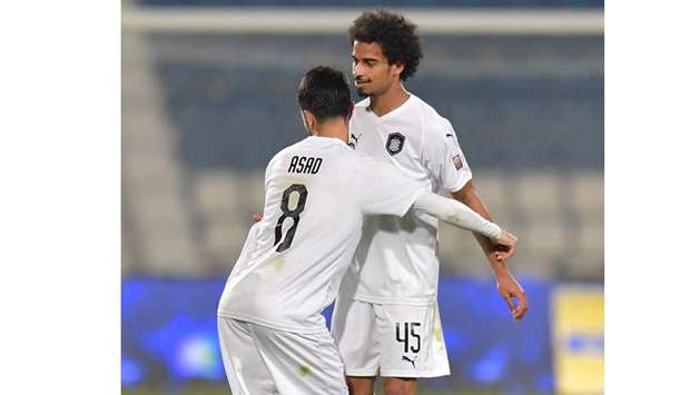 Al Saddu2019s Akram Afif (right) celebrates after scoring the winner against Al Khor in the QNB Stars League match Tuesday. PICTURE: Noushad Thekkayil