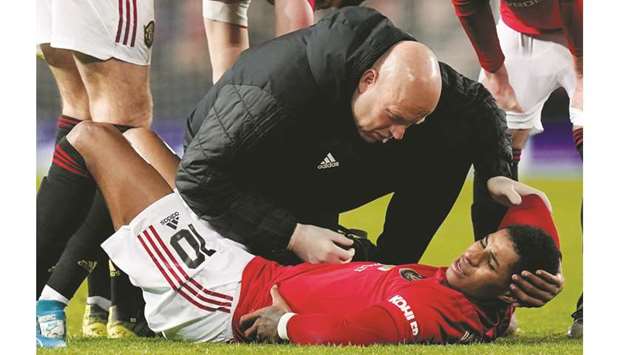 Manchester United forward Marcus Rashford faces at least six weeks on the sidelines after he suffered a stress fracture of the back. (AFP)