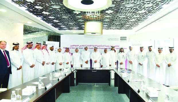 Ashghal officials with representatives of various contracting companies and CMC members at the signing ceremony. PICTURE: Noushad Thekkayil.