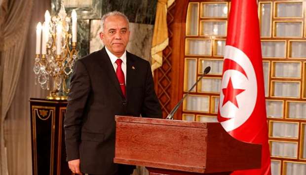 Tunisian Prime minister designate Habib Jemli speaks during a news conference in Tunis