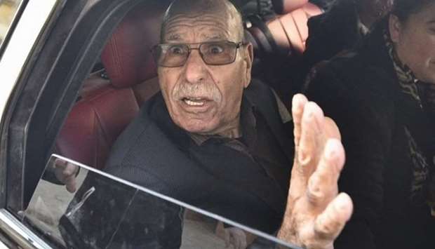Algerian war veteran Lakhdar Bouregaa gestures in a car upon his release in Algiers