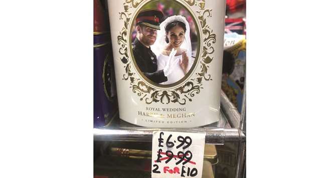Discounted merchandise depicting Harry and Meghan is displayed in Windsor, Britain.