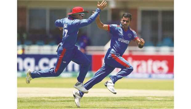 Afghanistan players celebrate the fall of a UAE wicket during their ICC U-19 World Cup match yesterday. (ICC)