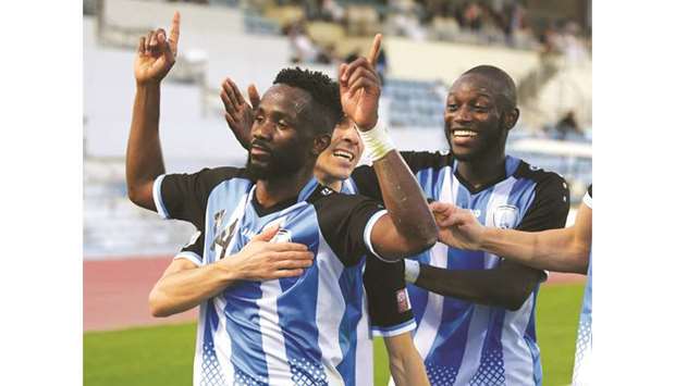 Al Wakrahu2019s Omar Ali (front) celebrates even as he is congratulated by teammates after scoring against Al Sadd yesterday. PICTURE: Noushad T