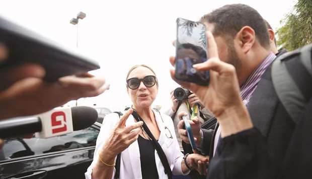 Brazilian actress Regina Duarte speaks with journalists as she arrives at the Brasilia International Airport yesterday. Duarte was invited by President Jair Bolsonaro to be the countryu2019s next culture secretary in place of Roberto Alvim, who was fired by Bolsonaro over a speech in which he appeared to quote Adolf Hitleru2019s propaganda minister Joseph Goebbels.