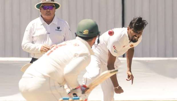 Sri Lankau2019s Suranga Lakmal (right) delivers a ball to Zimbabweu2019s Brendan Taylor (centre) during the fifth day of the first Test at the Harare Sports Club in Harare yesterday. (AFP)