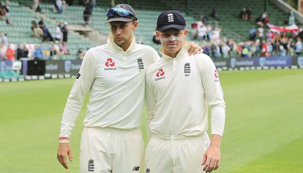 Englandu2019s Joe Root (left) and Ollie Pope pose for a portrait during the fifth day of the third Test against South Africa in Port Elizabeth on Monday. (AFP)