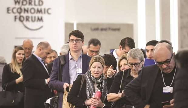 Participants queue for a session during the World Economic Forum annual meeting in Davos yesterday.