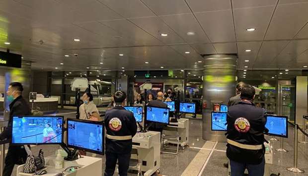 The passenger screening team from MoPH and HMC monitors travellers from a  thermal inspection site at Hamad International Airport. Supplied picture