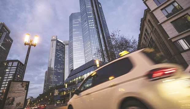 Automobiles pass the Deutsche Bank twin tower headquarters at dawn in Frankfurt. The bank has almost doubled the debt it holds of Altico Capital India to Rs3bn ($42.1mn) in the last four months.