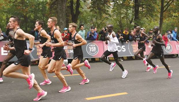 In this October 12, 2019, picture, Kenyau2019s Eliud Kipchoge (third from right), the marathon world record holder, runs in Alphafly version of Nike Vaporfly shoes with his pacemakers during his attempt to run a marathon in under two hours in Vienna, Austria. (Reuters)