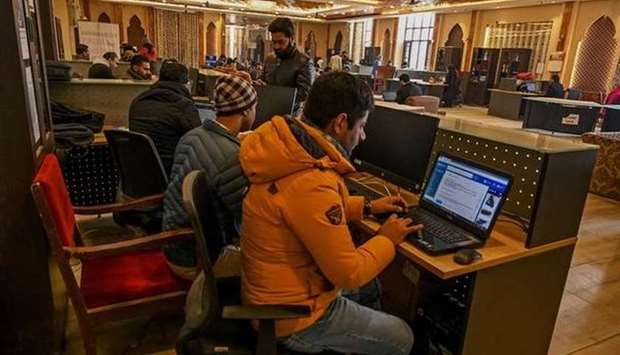 Kashmiri students use the net at an internet centre in Srinagar.
