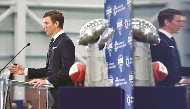 NY Giants quarterback Eli Manning announces retirement next to the two Vince Lombardi trophies he won with the team during a press conference on Friday. (USA TODAY Sports)