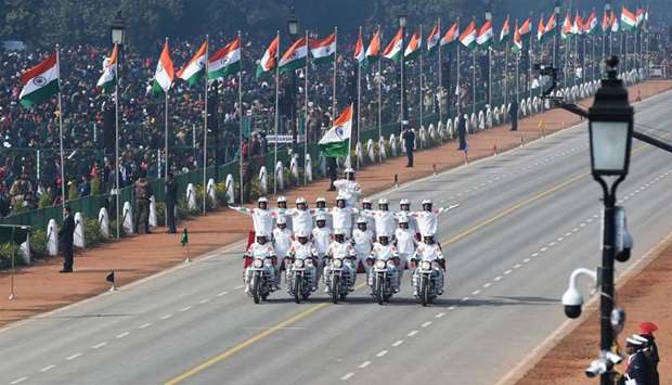 Central Reserve Police Force (CRPF) women motorcycle team members perform during the Republic Day parade in New Delhi
