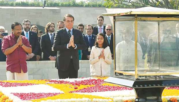 Brazilu2019s President Jair Bolsonaro pays homage at the Mahatma Gandhi memorial at Rajghat in New Delhi yesterday.