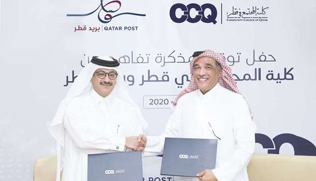 CCQ president Dr Mohamed al-Naemi and Qatar Post chairman and managing director Faleh Mohamed al-Nuaimi at the MoU-signing ceremony.